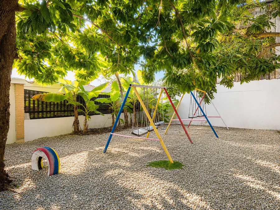 Swings and a painted tyre, in the shade all afternoon