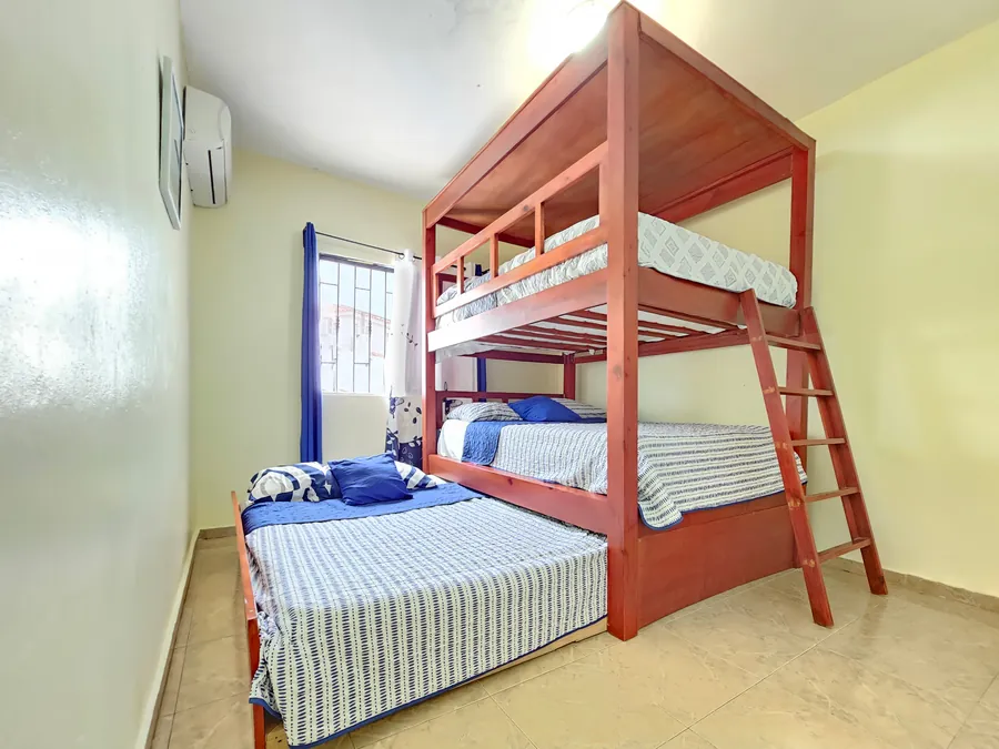The third bedroom: bunks and a bed alongside, four sleep here