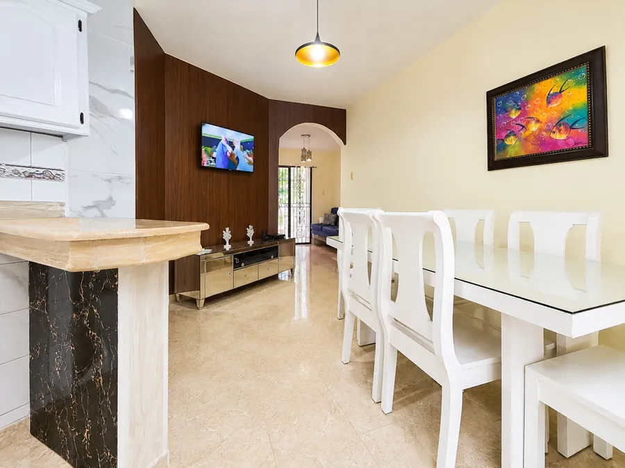The dining table beside the breakfast bar