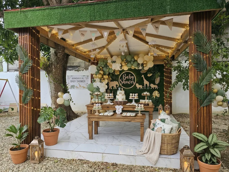 The gazebo dressed for a baby shower, with a balloon arch, bunting and fairy lights